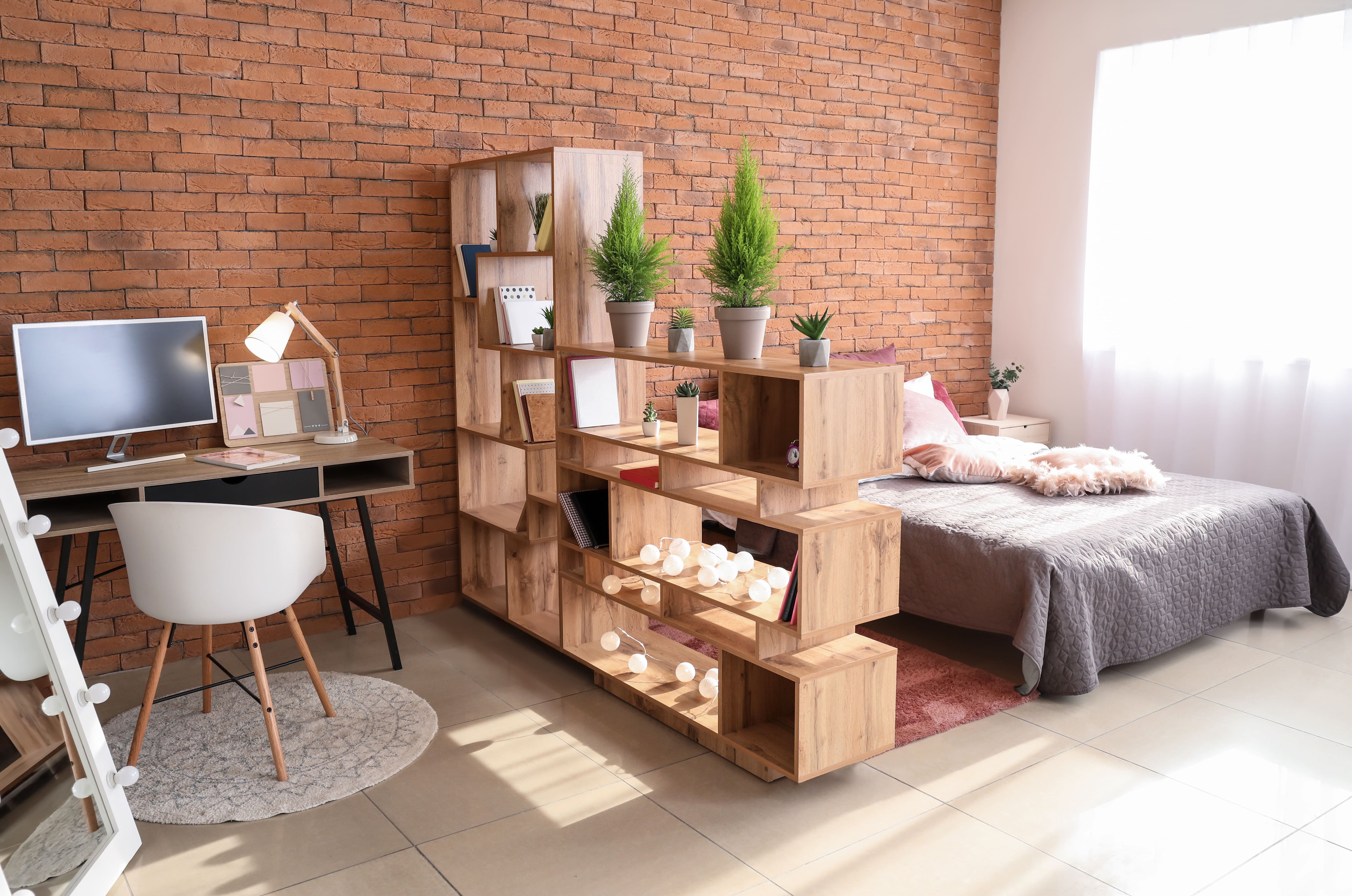 Tall shelving unit to divide studio apartment