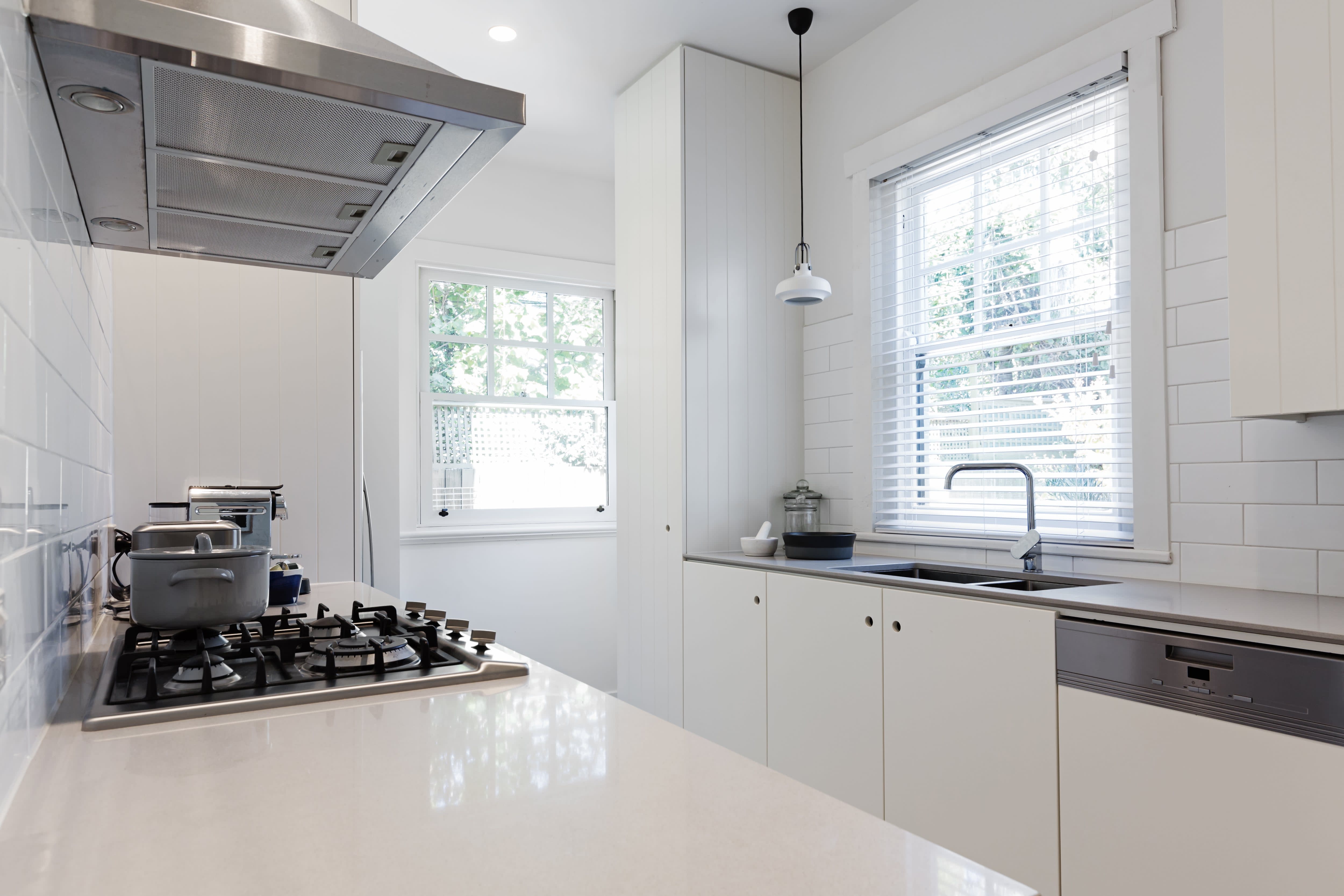 A small all-white galley kitchen