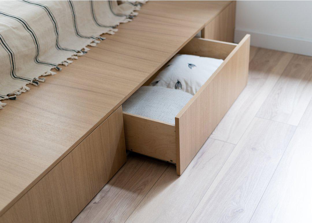 Built-in drawers of a wooden bed frame