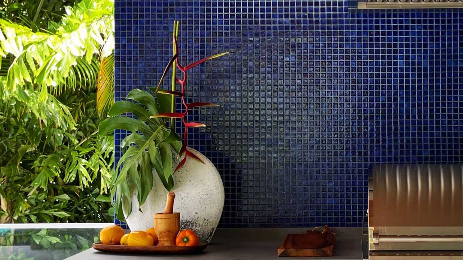 An outdoor kitchen with blue tile