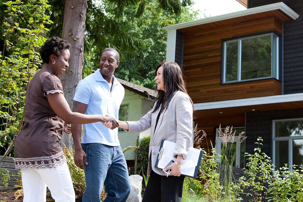 Couple meeting a real estate agent