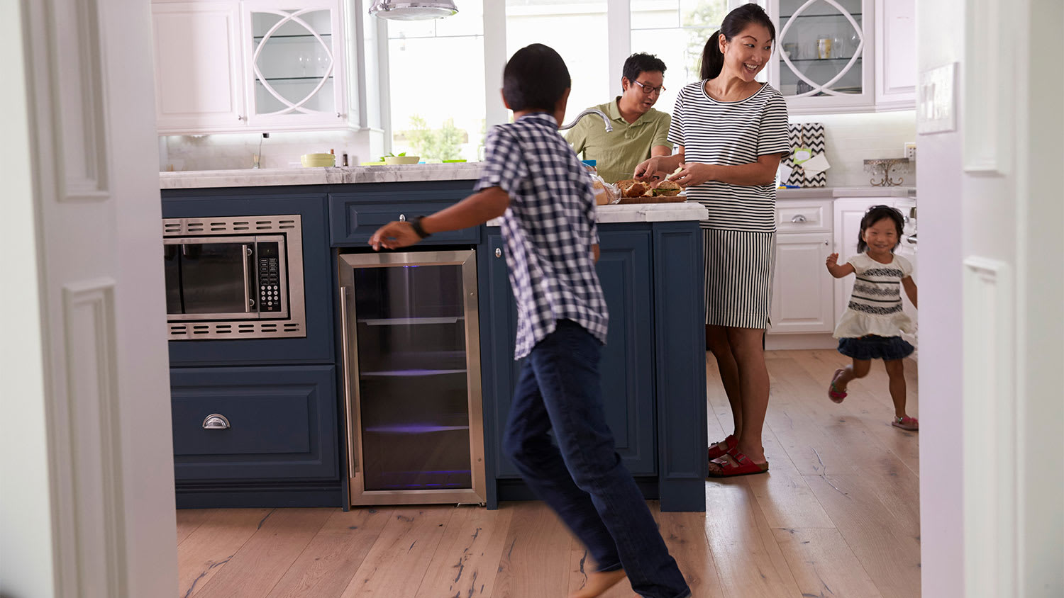 Family playing in kitchen
