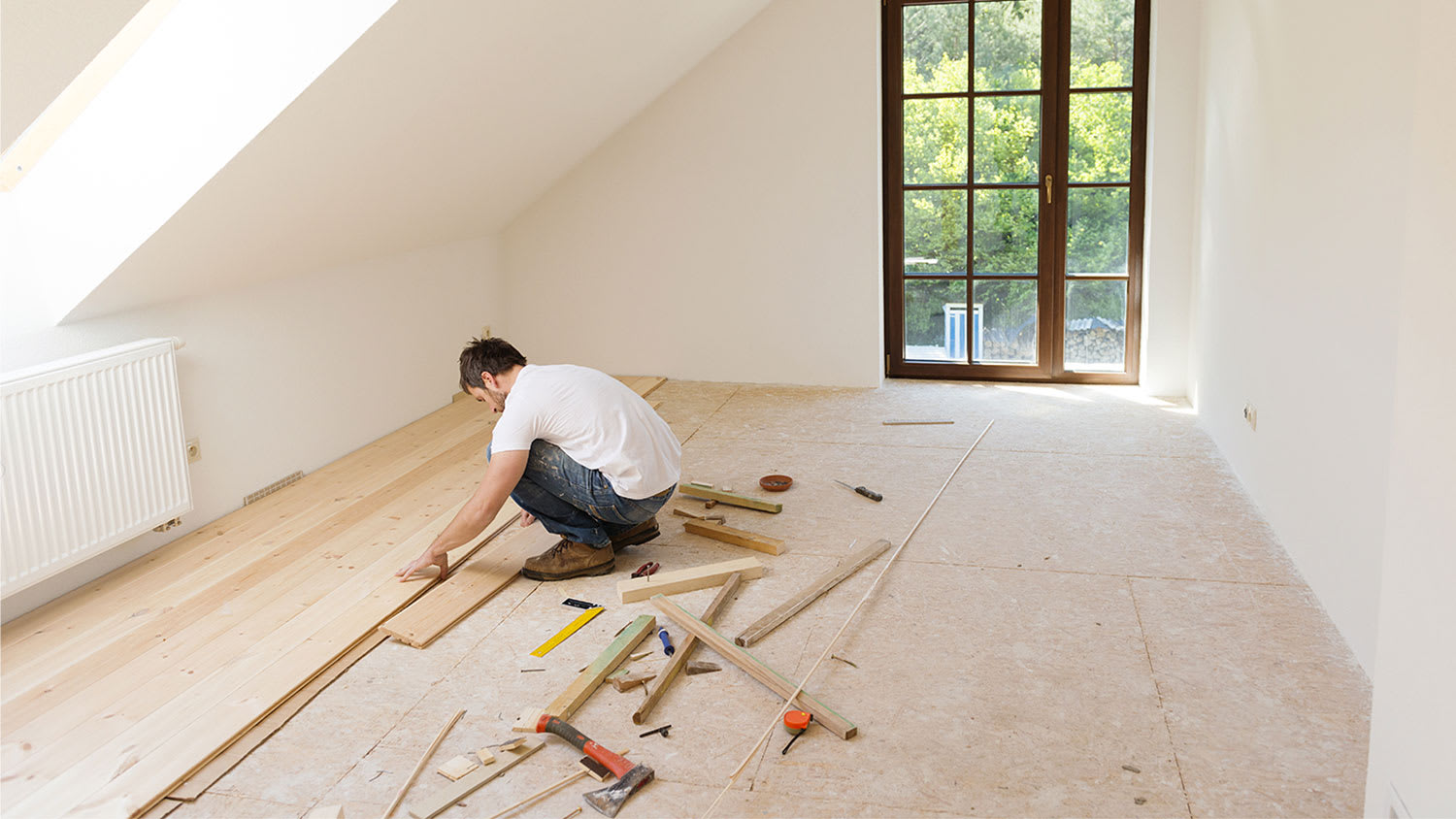 Man installing new flooring