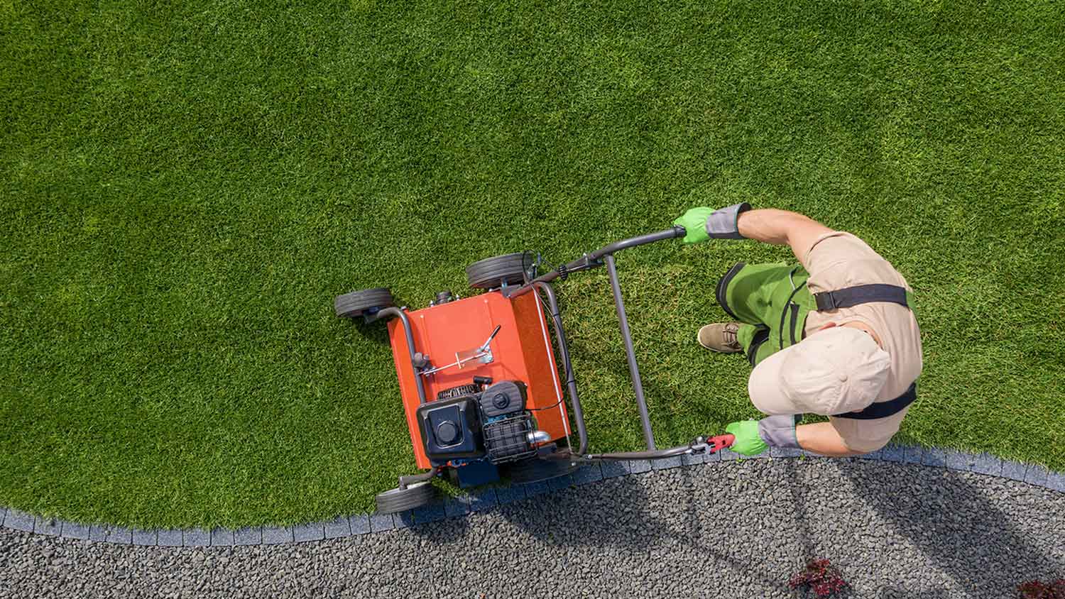 Man using lawn aerator