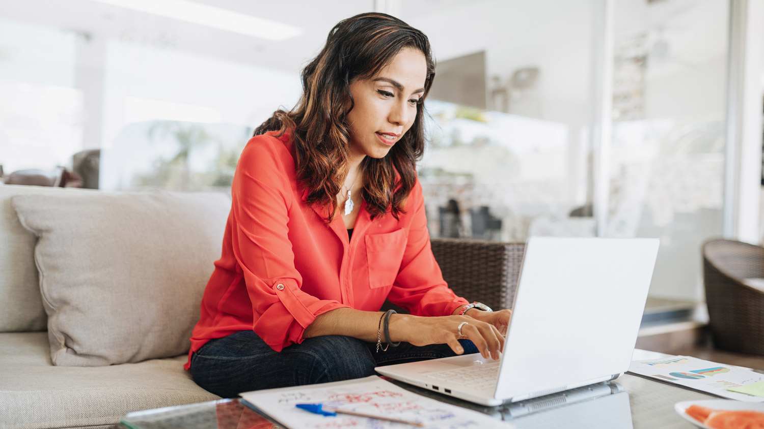 A woman doing online research on her laptop