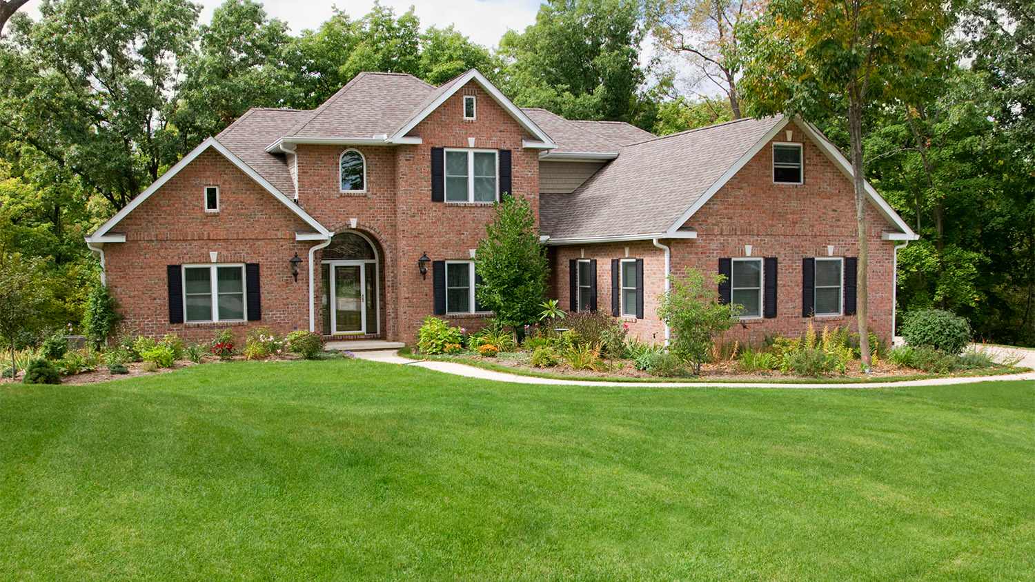 large house with fresh cut lawn