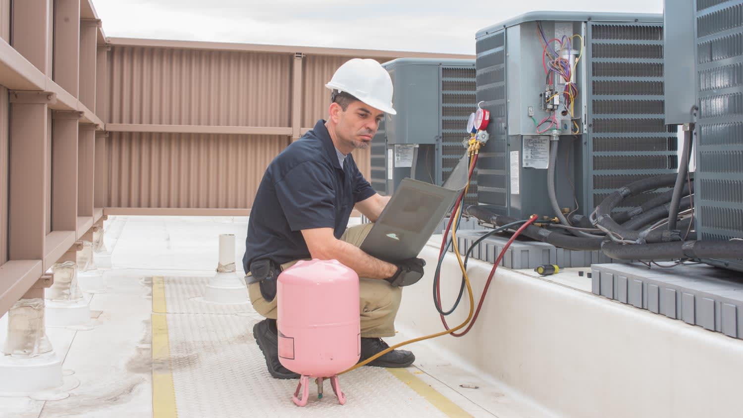 A HVAC technician with panel