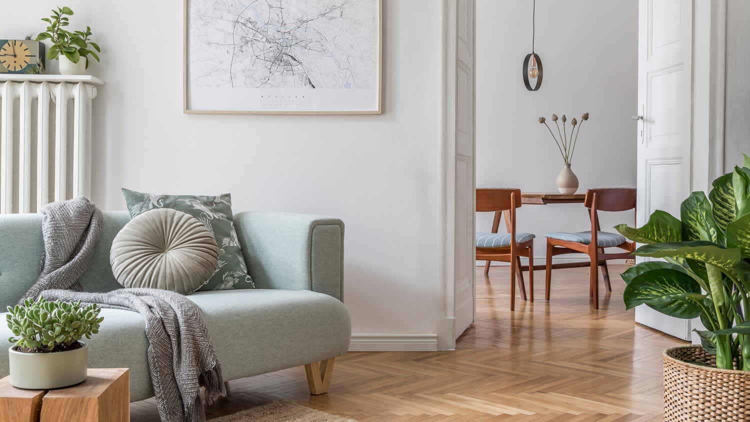 A neutral palette living room with beautiful pastel mint sofa
