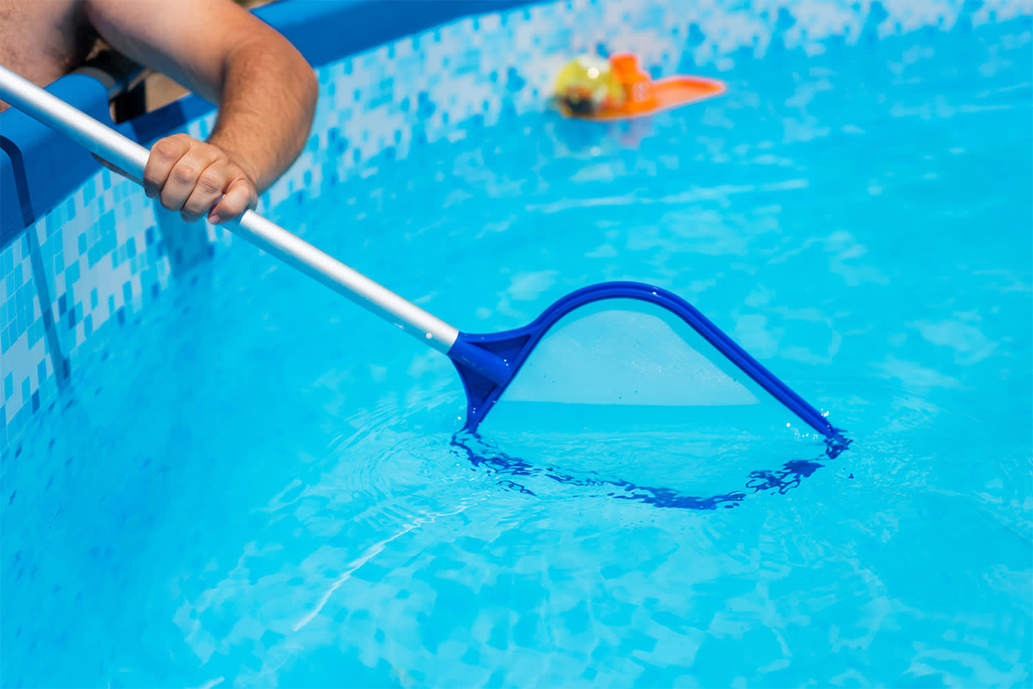 Pool being skimmed
