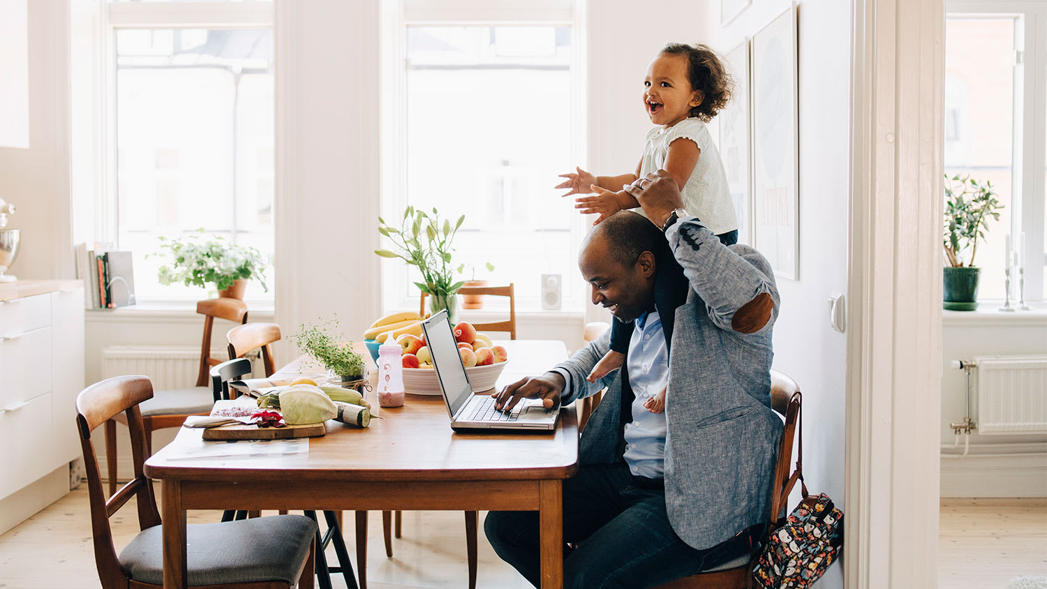 Father and child at dining table