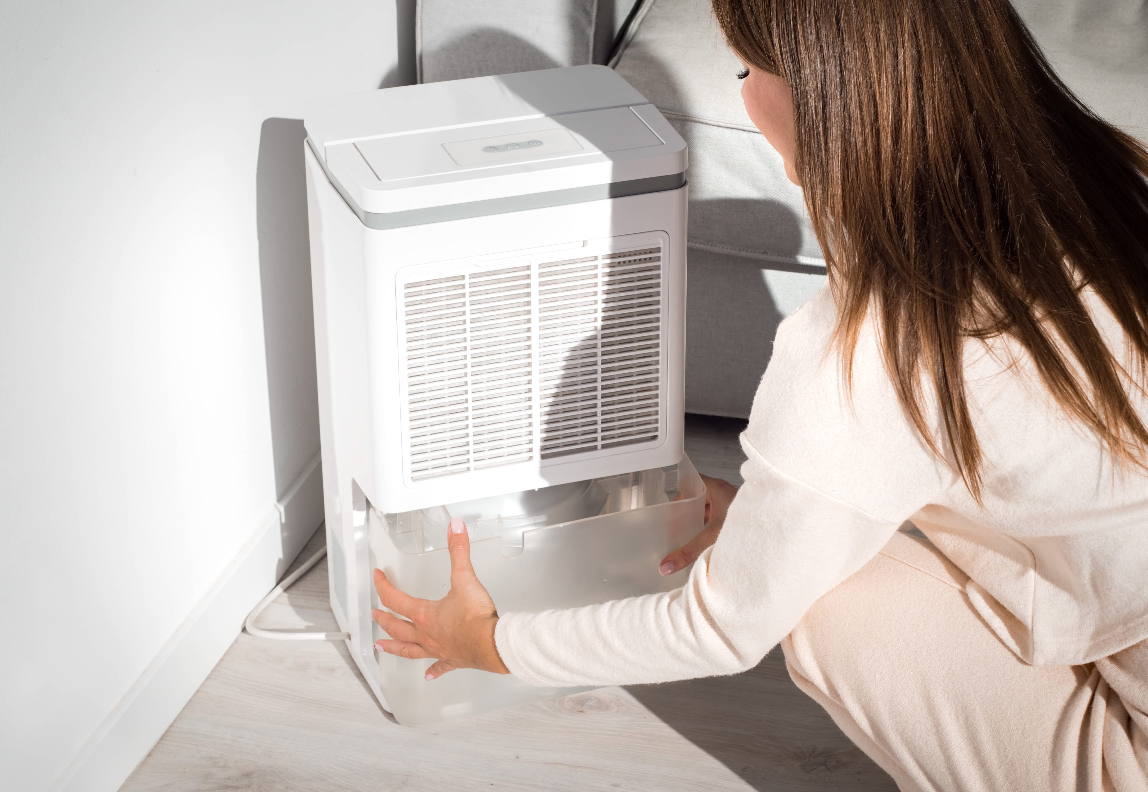 Woman taking apart humidifier