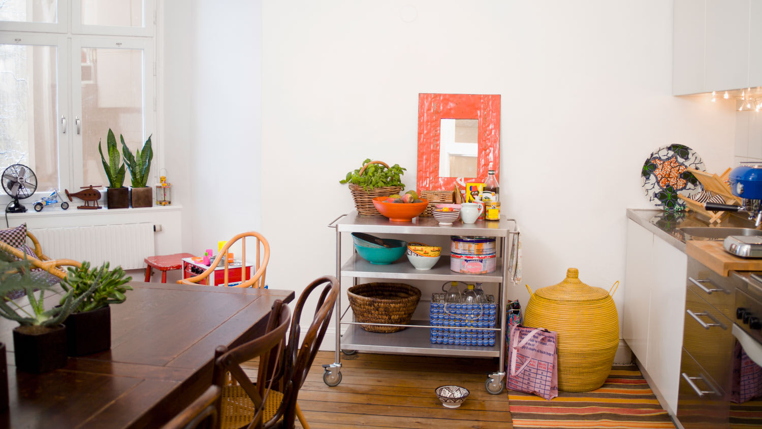 A kitchen cart with a dining table on the foreground