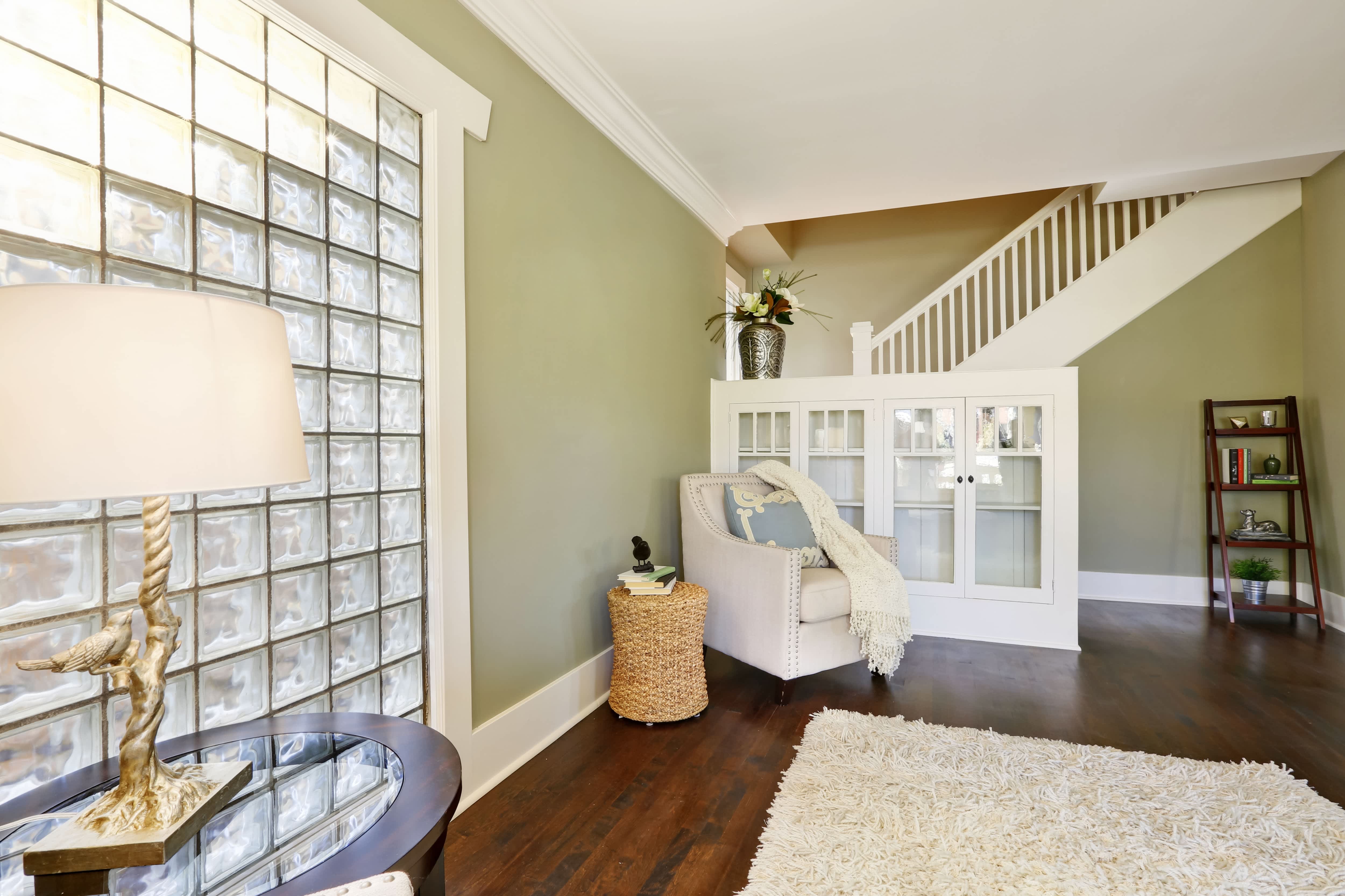 Built-in cabinetry in pony wall near entryway