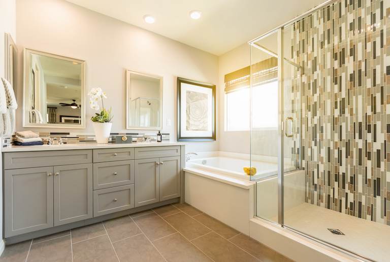a custom bathroom with a bathtub and shower side by side