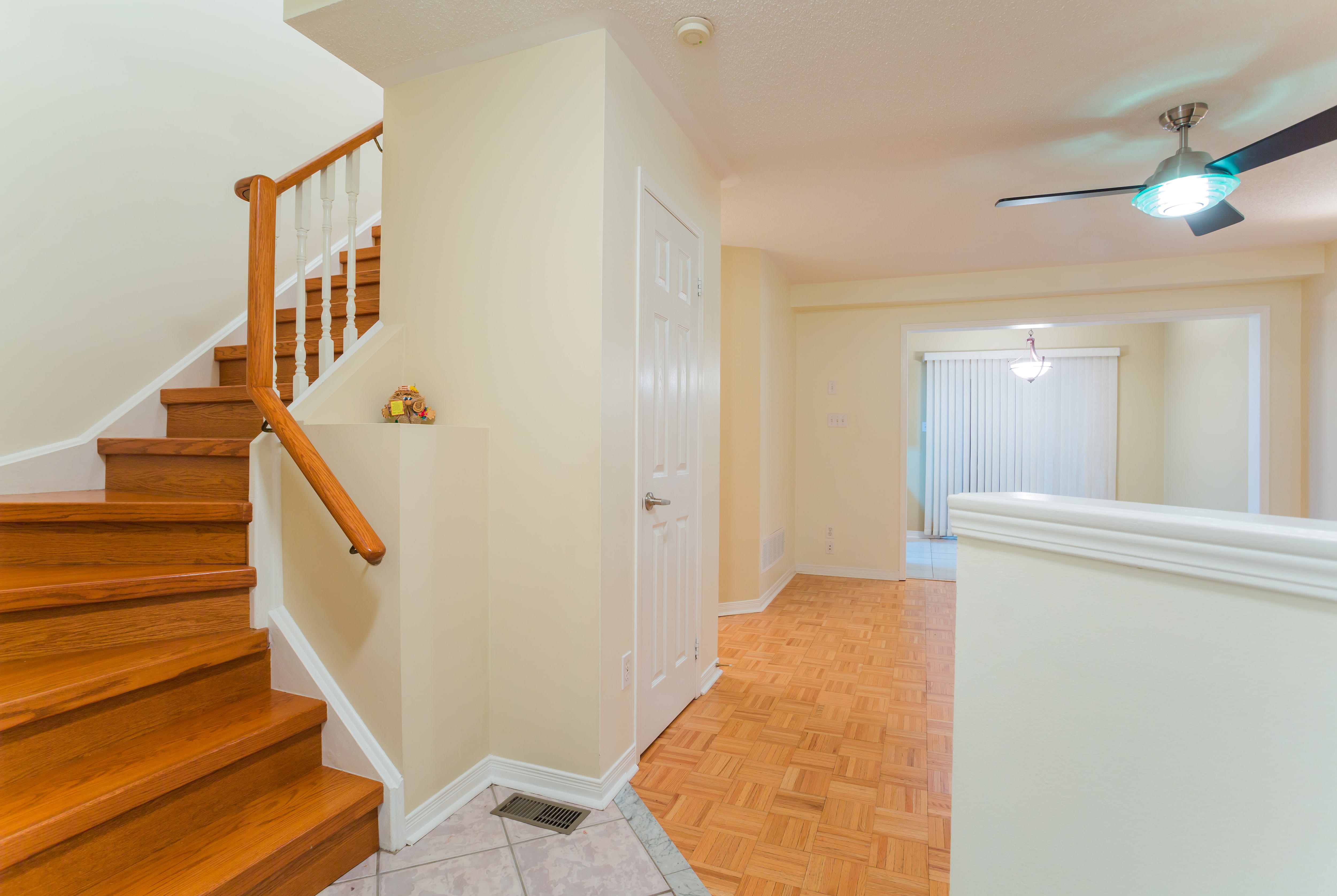 Pony wall in entryway next to staircase