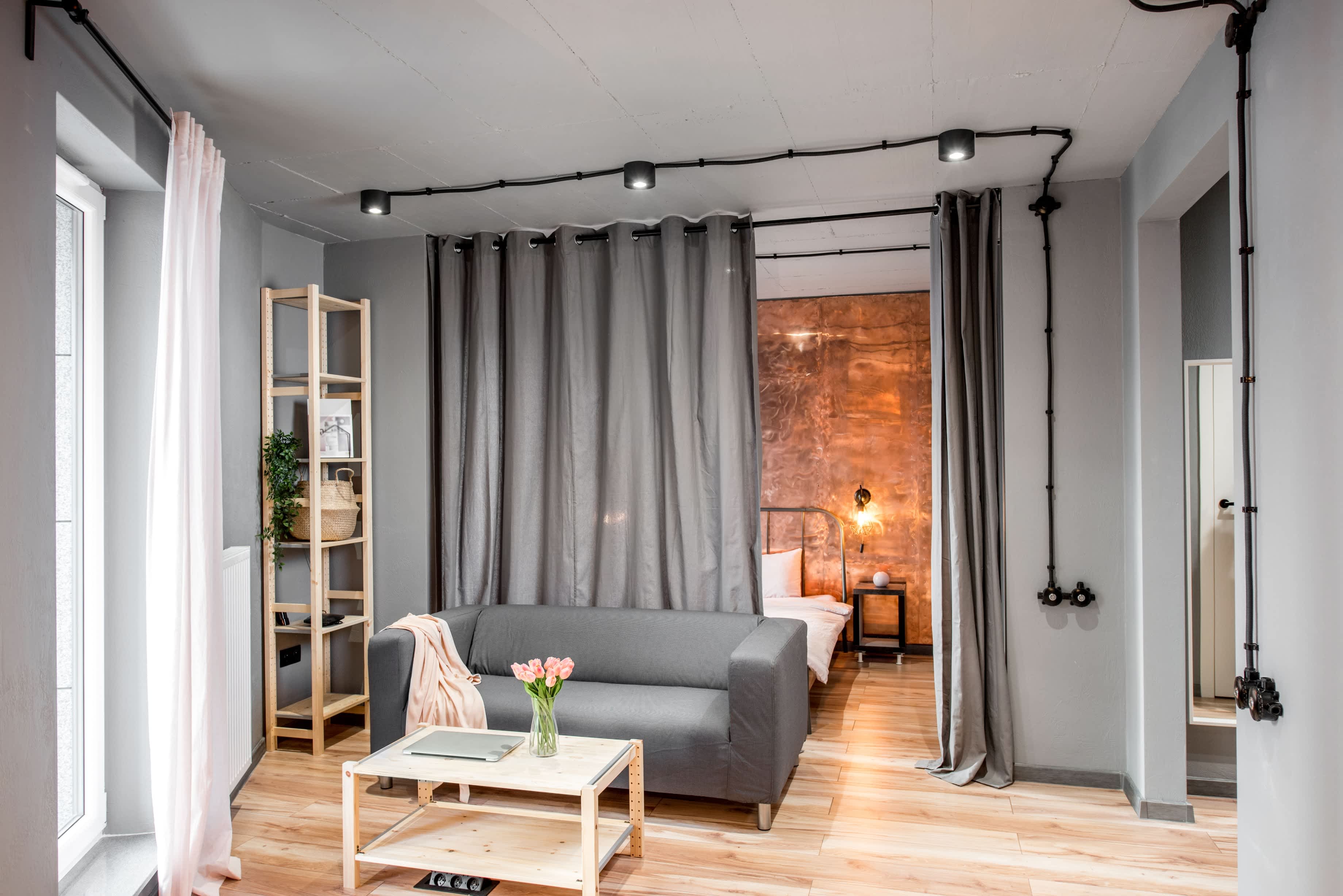 Curtains separating open-concept floor plan