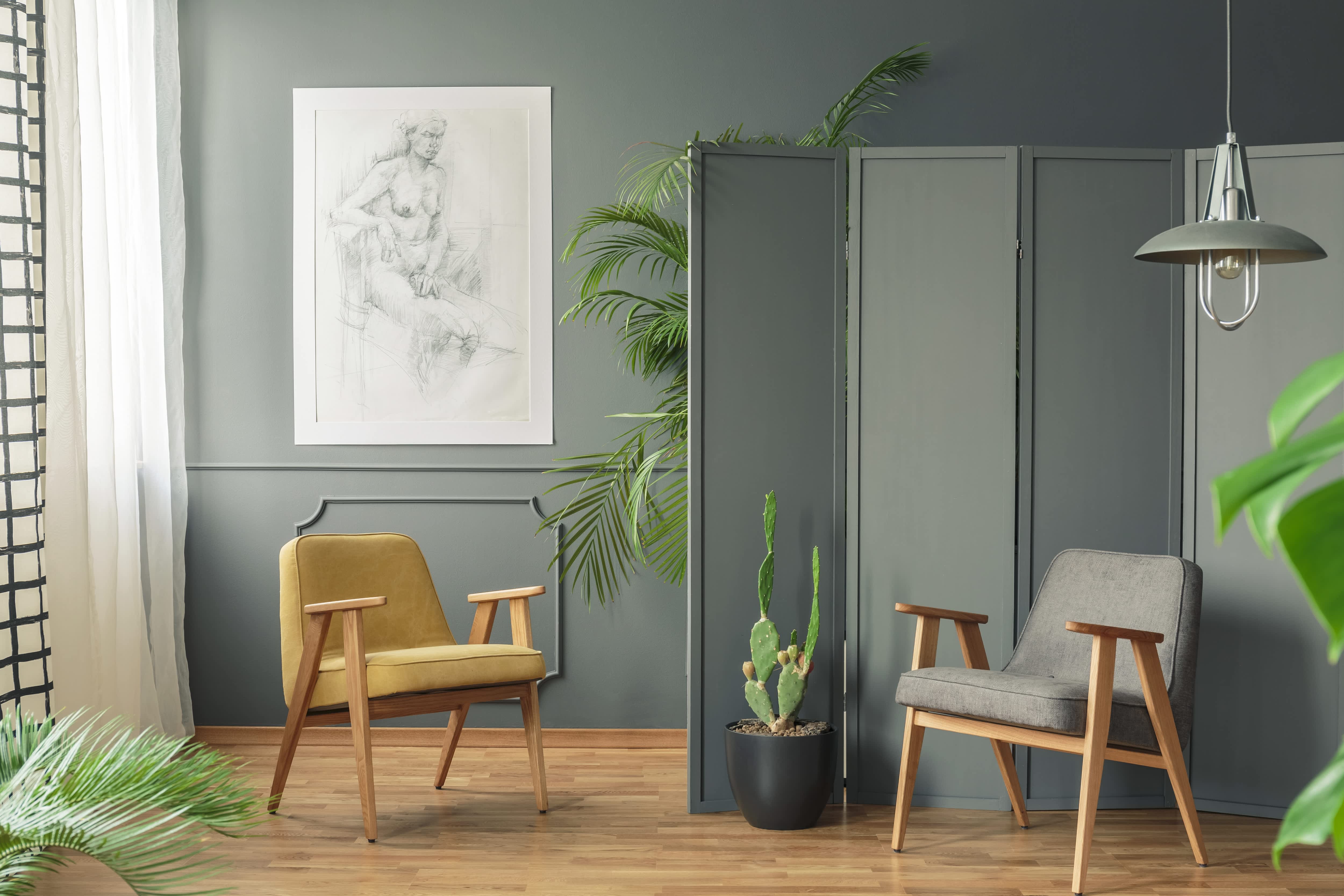 Green folding screen in room