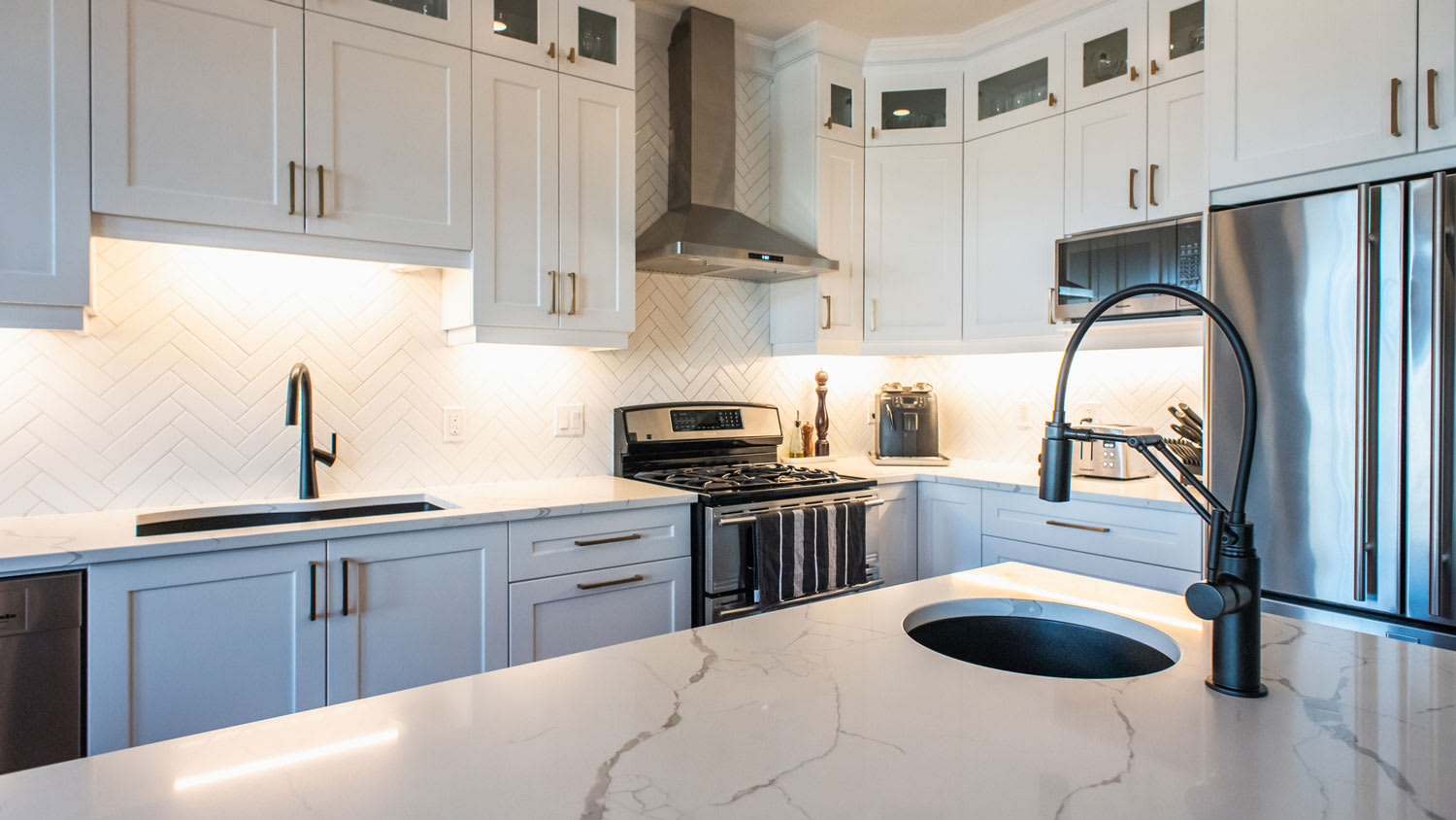 A transitional kitchen with a marble countertop