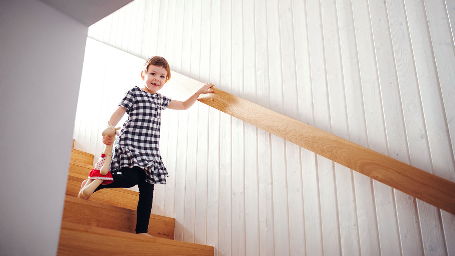 Child walking down basement stairs