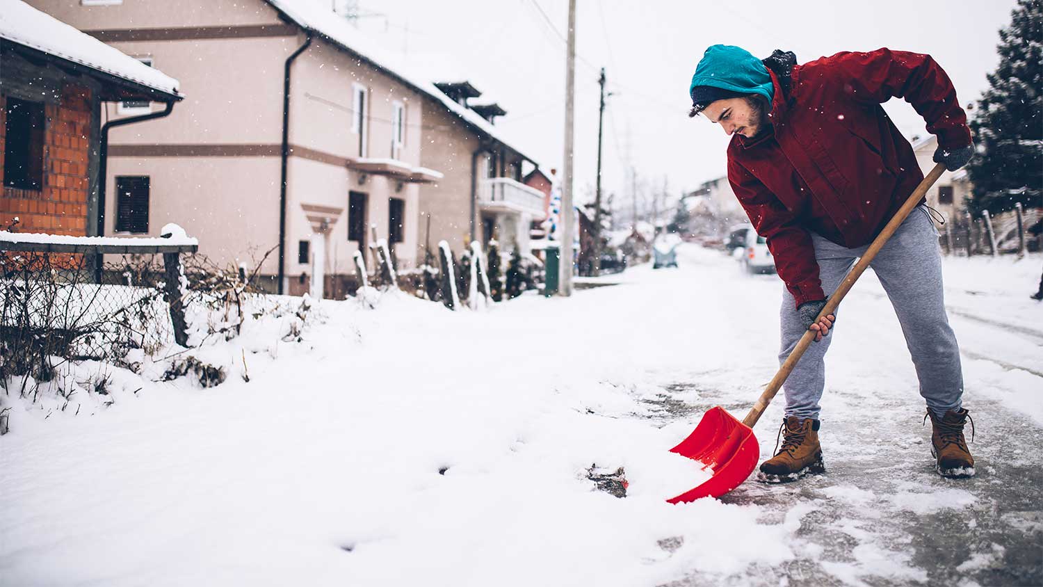 Man shoveling sidewalk