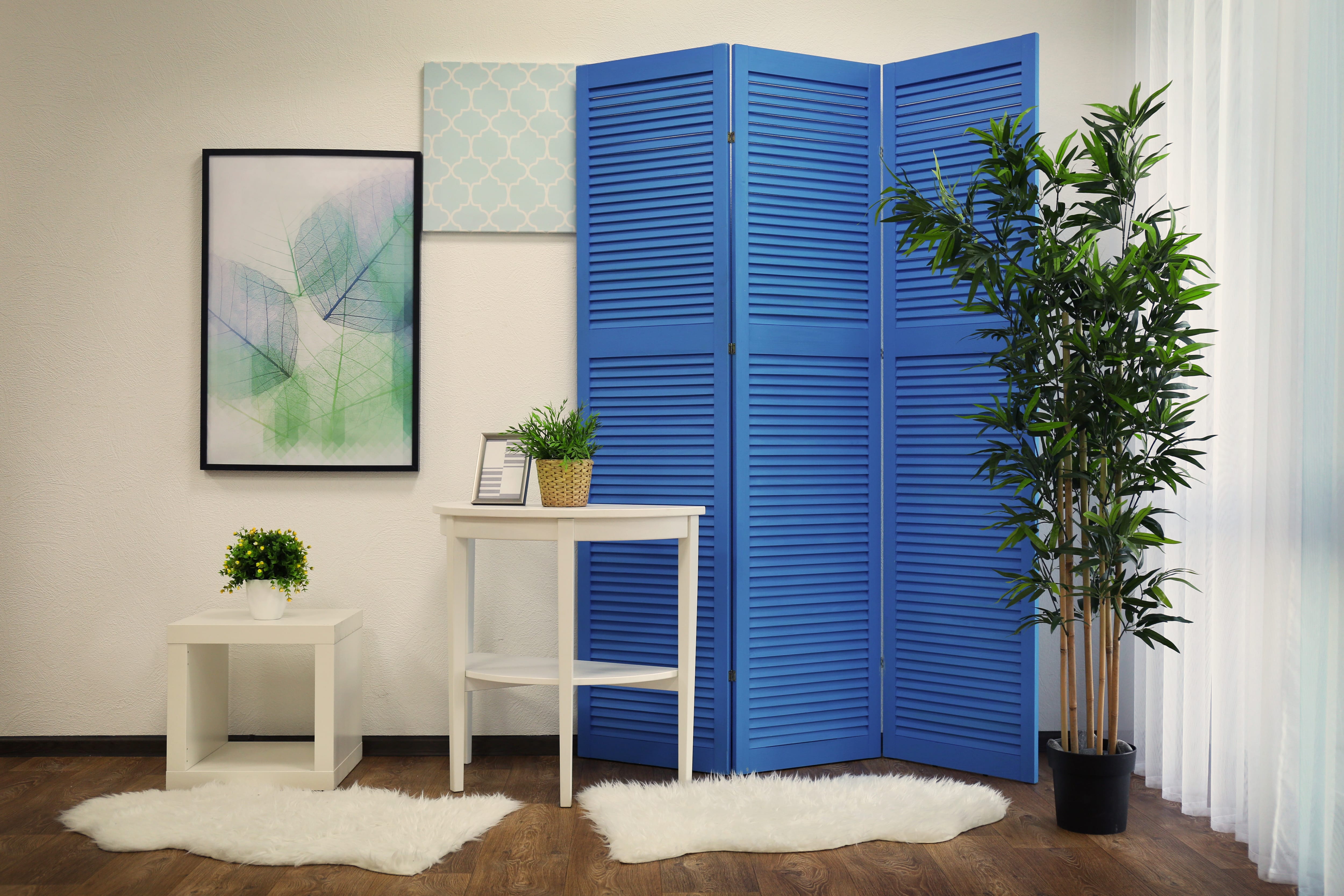 Bright blue folding screen in room