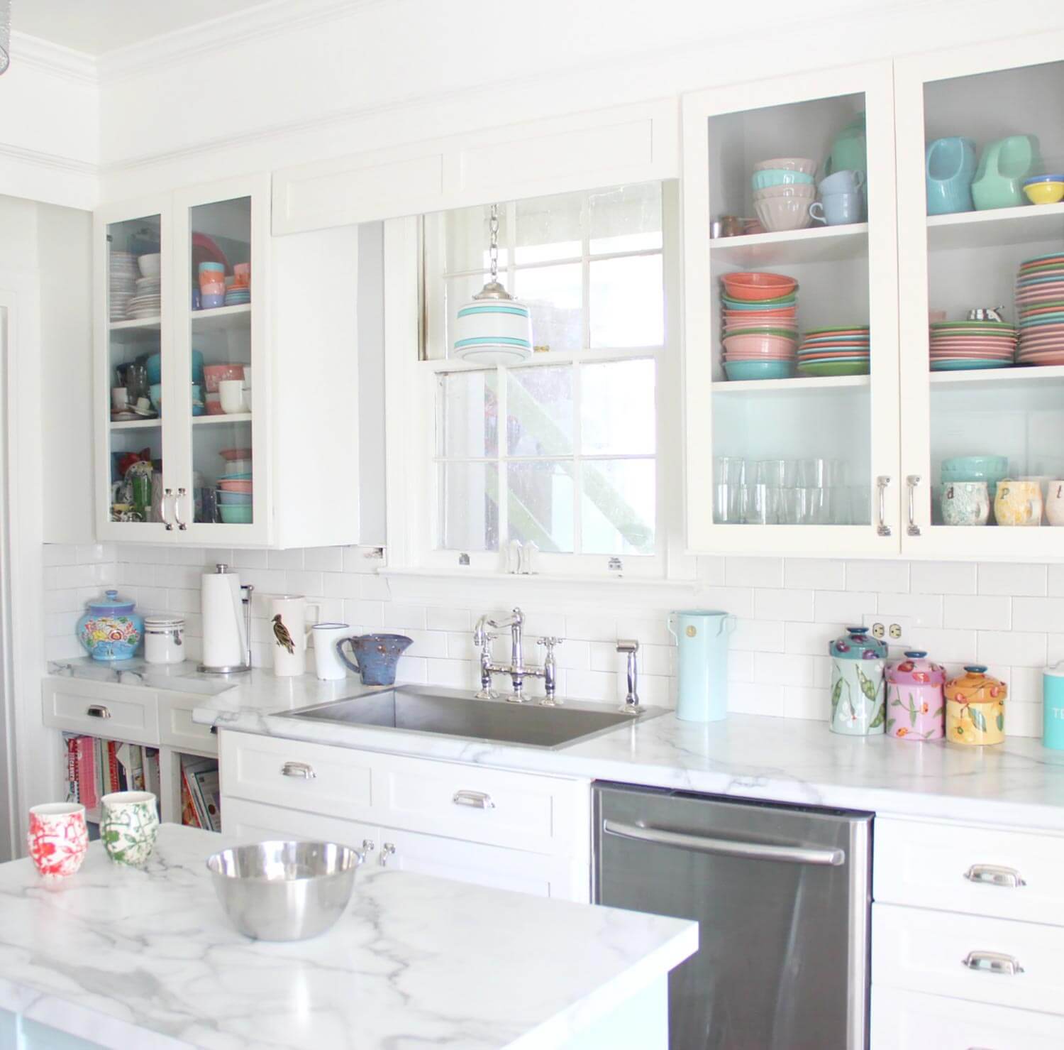 A bright kitchen with glass window cabinets