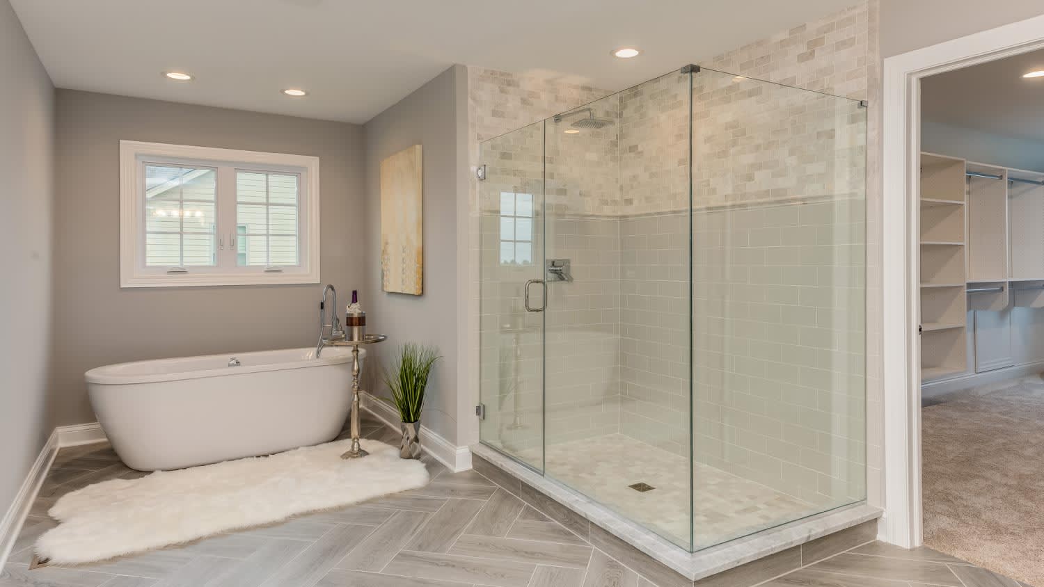 A master bathroom with freestanding tub