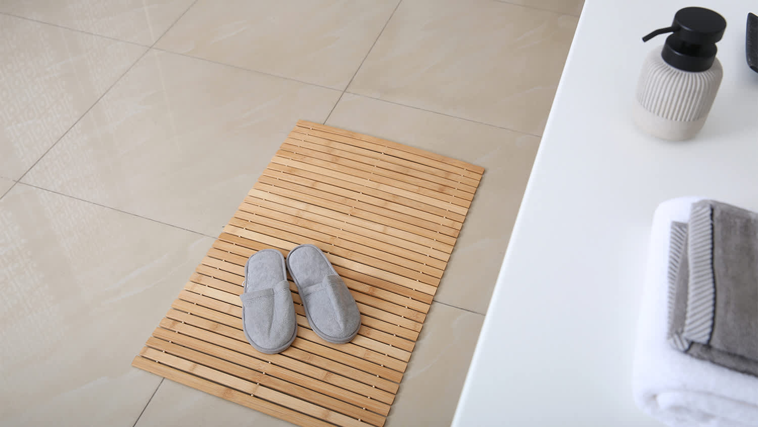 bamboo mat in bathroom with slippers