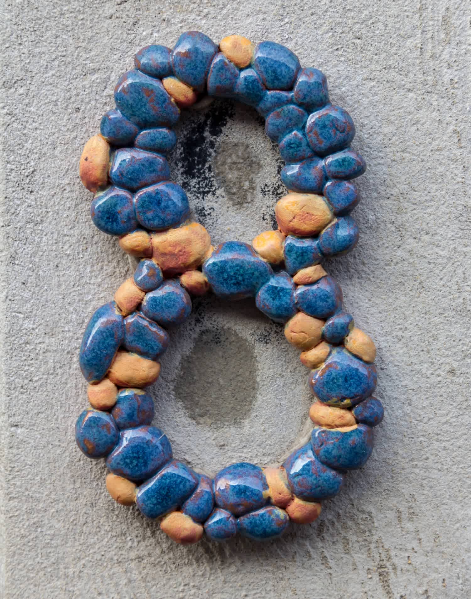 A decorative house number