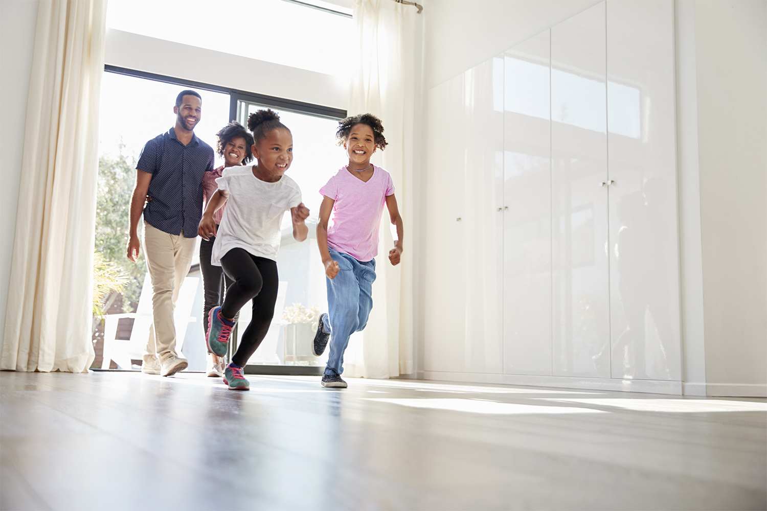 Family running into their house