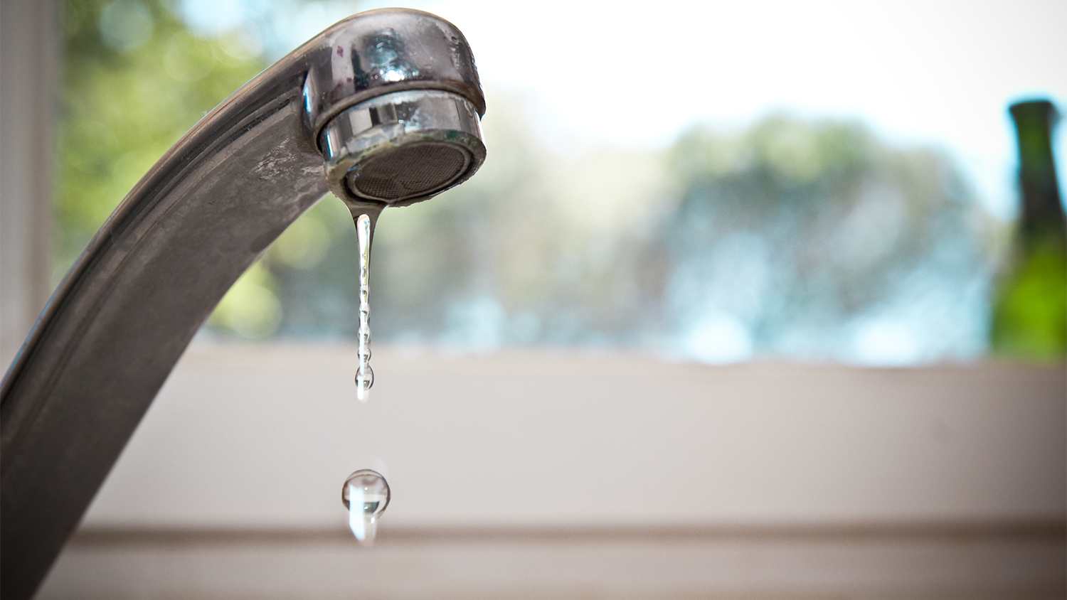 kitchen faucet dripping water