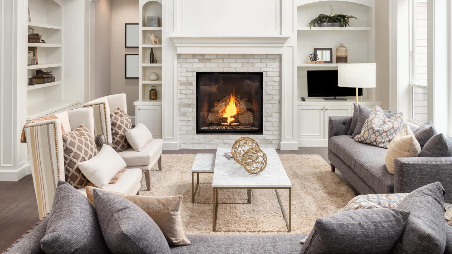 A luxury living room with a fireplace