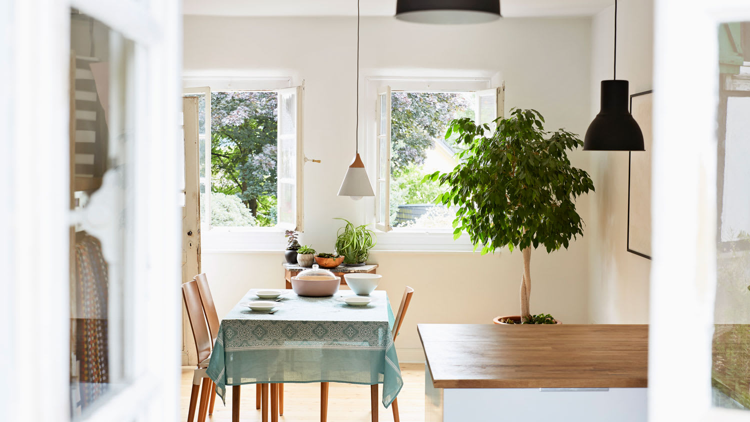 A bright kitchen with a set table