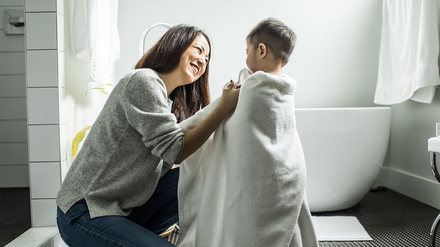 Mother and son in bathroom