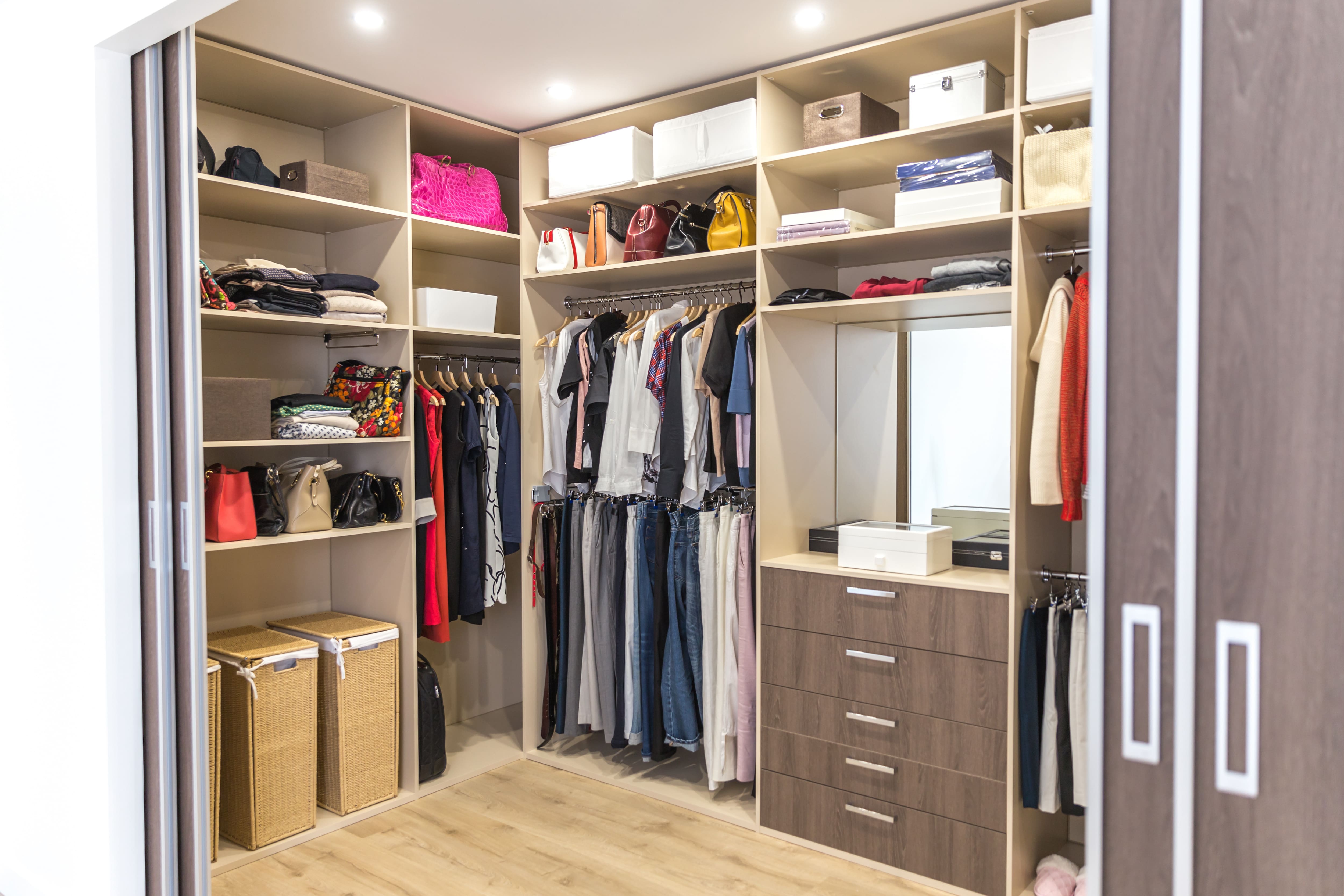 Two laundry baskets in a walk-in closet