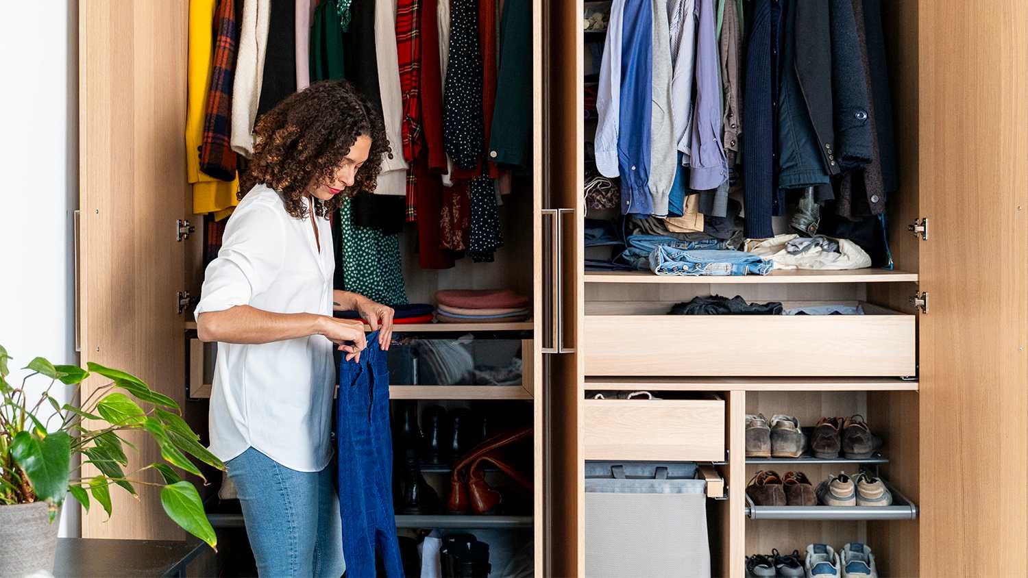 woman clearing out wardrobe