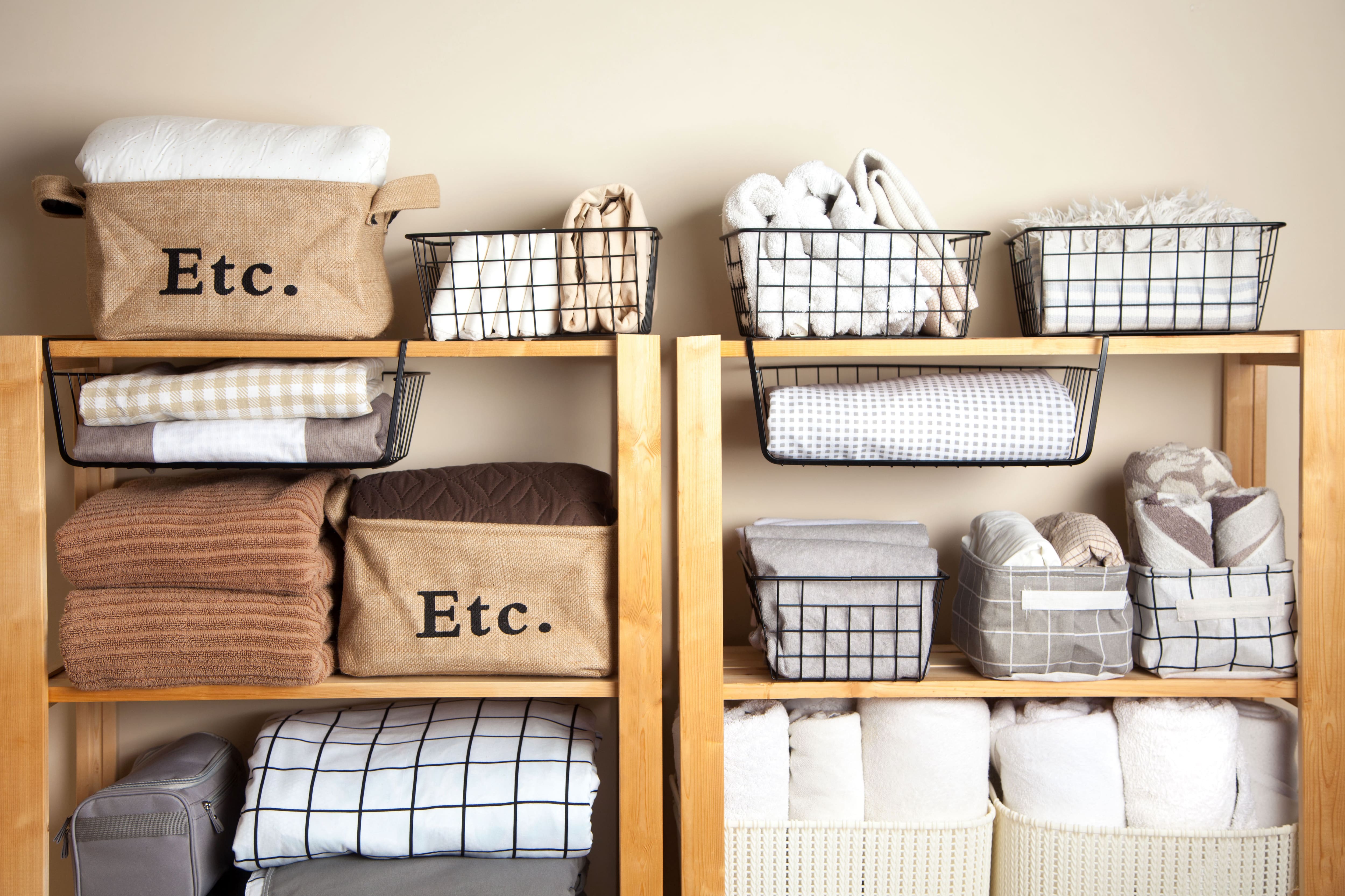 A wooden shelf with storage baskets