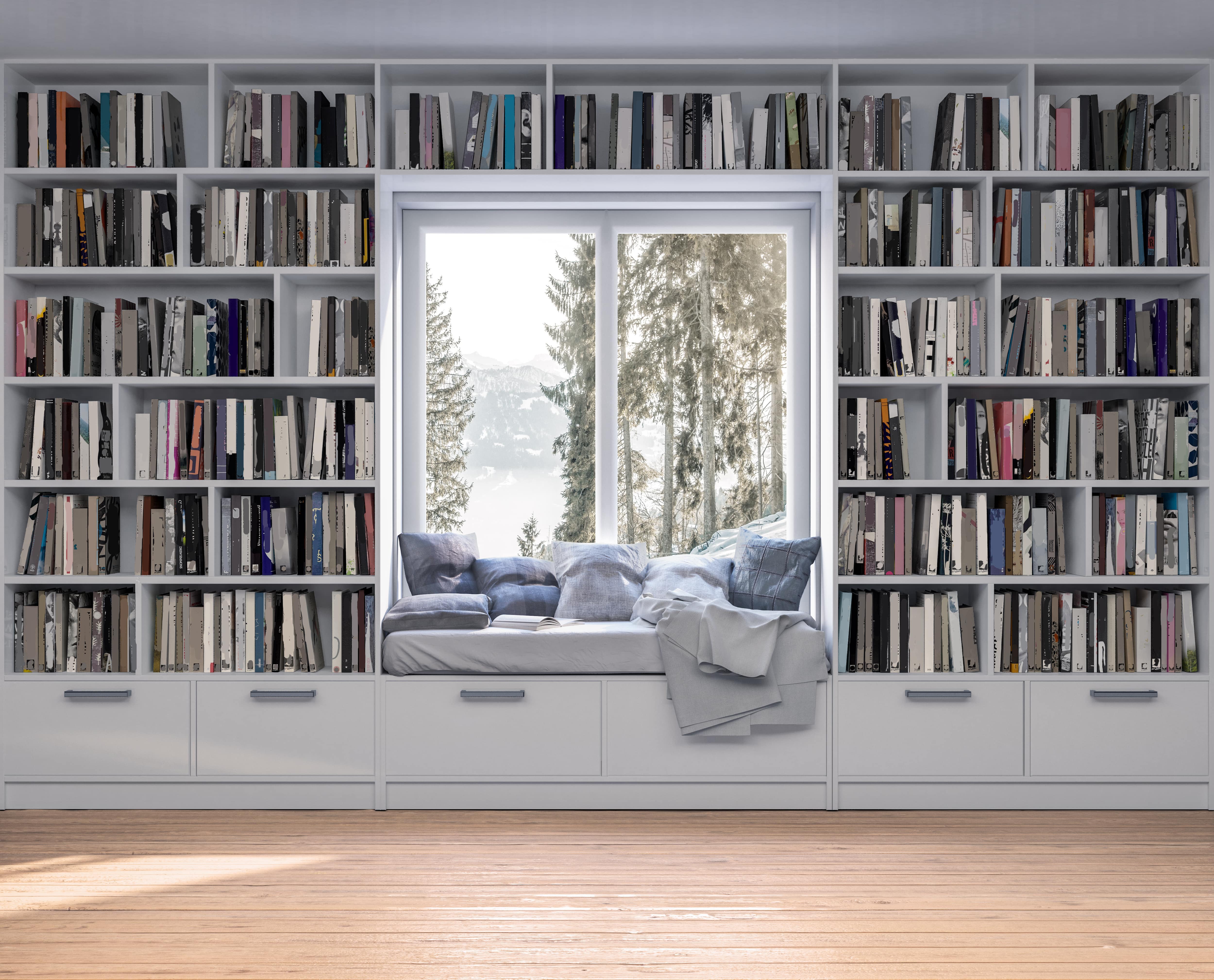 White bookshelves with window seat cutout overlooking pine trees and water