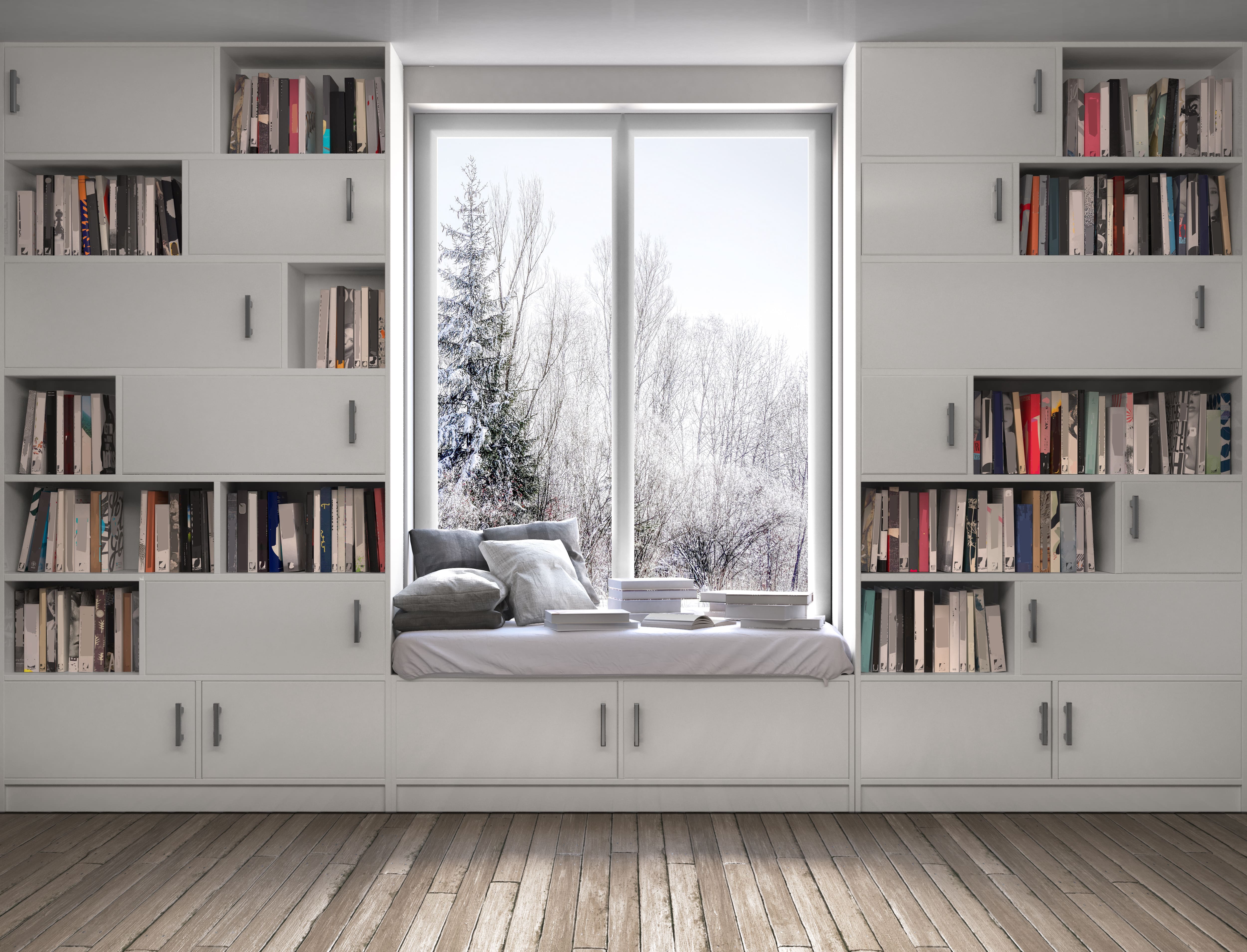 White modular bookshelves with window seat cutout overlooking snowy trees