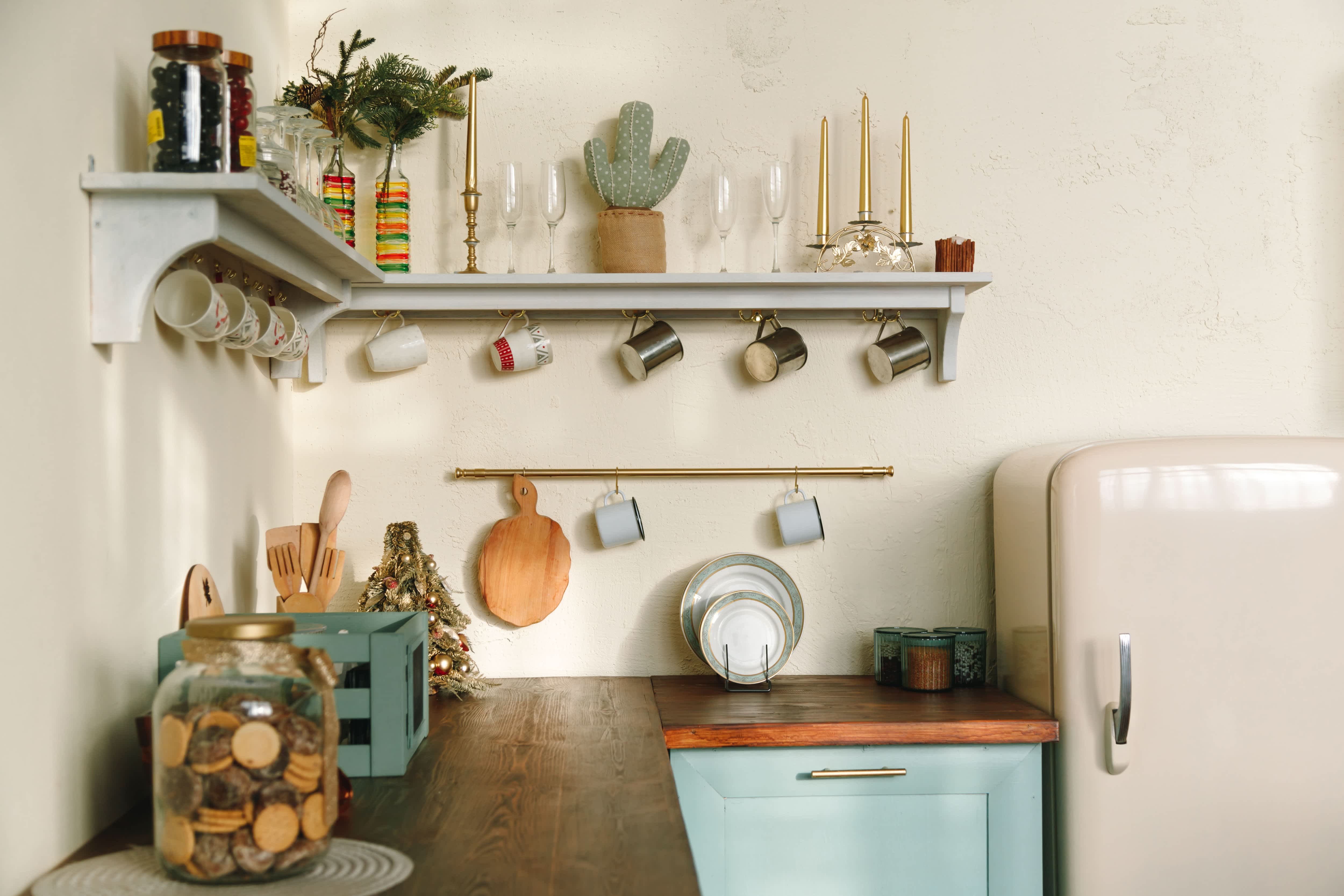 Open shelves in kitchen with hanging mugs