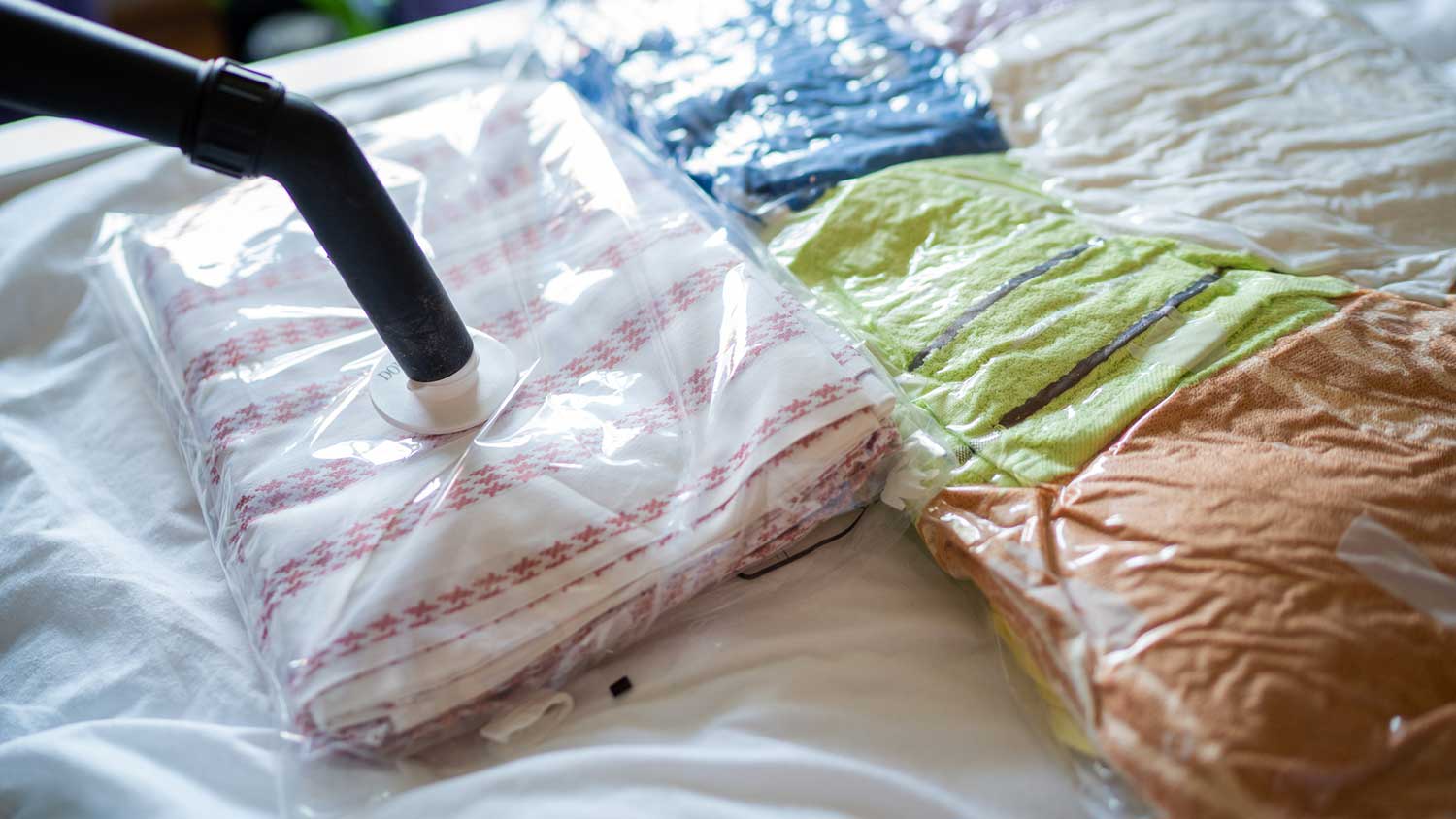 Packing clothes in vacuum sealed bags