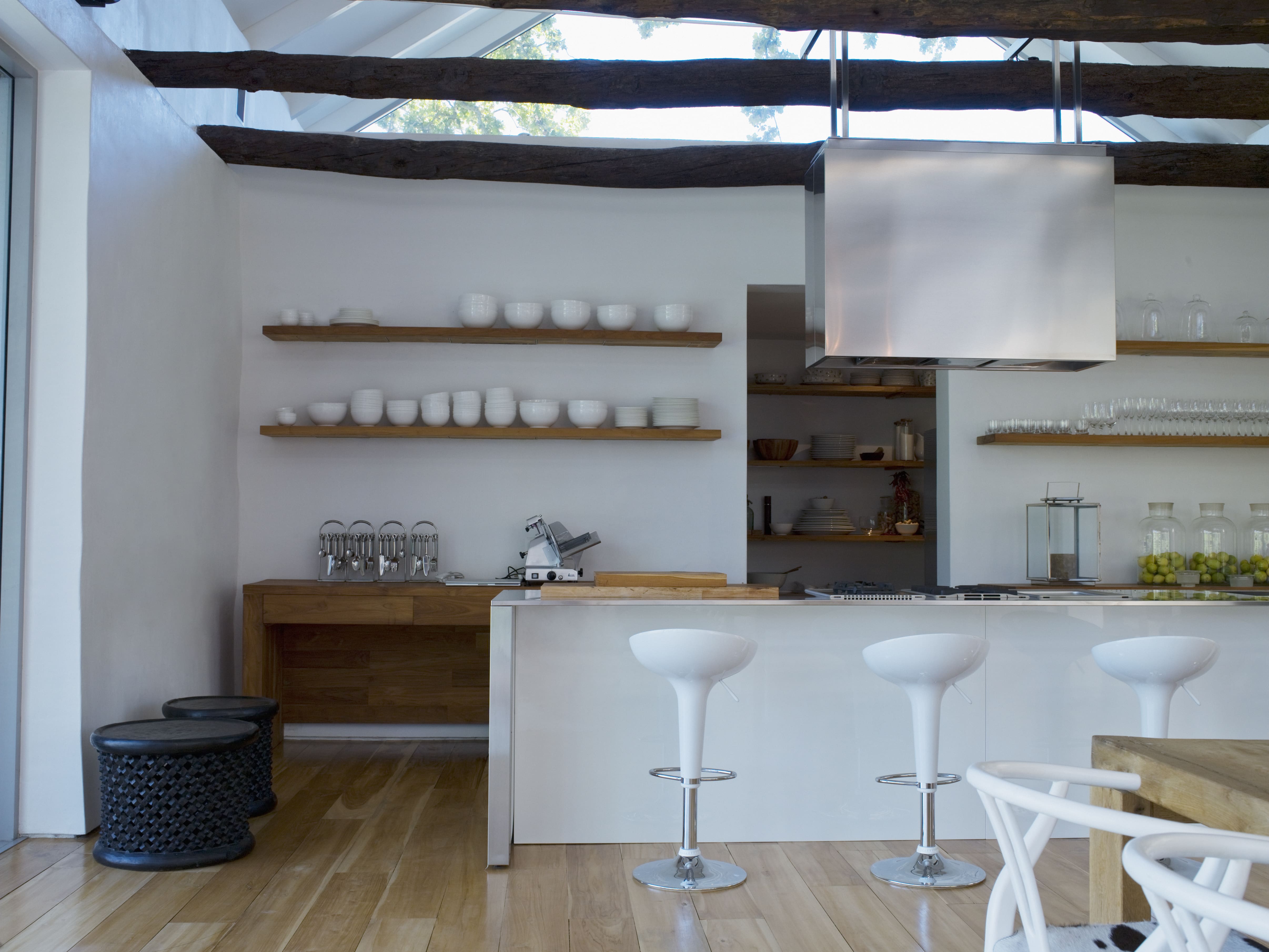 Large all white kitchen with open floating shelves
