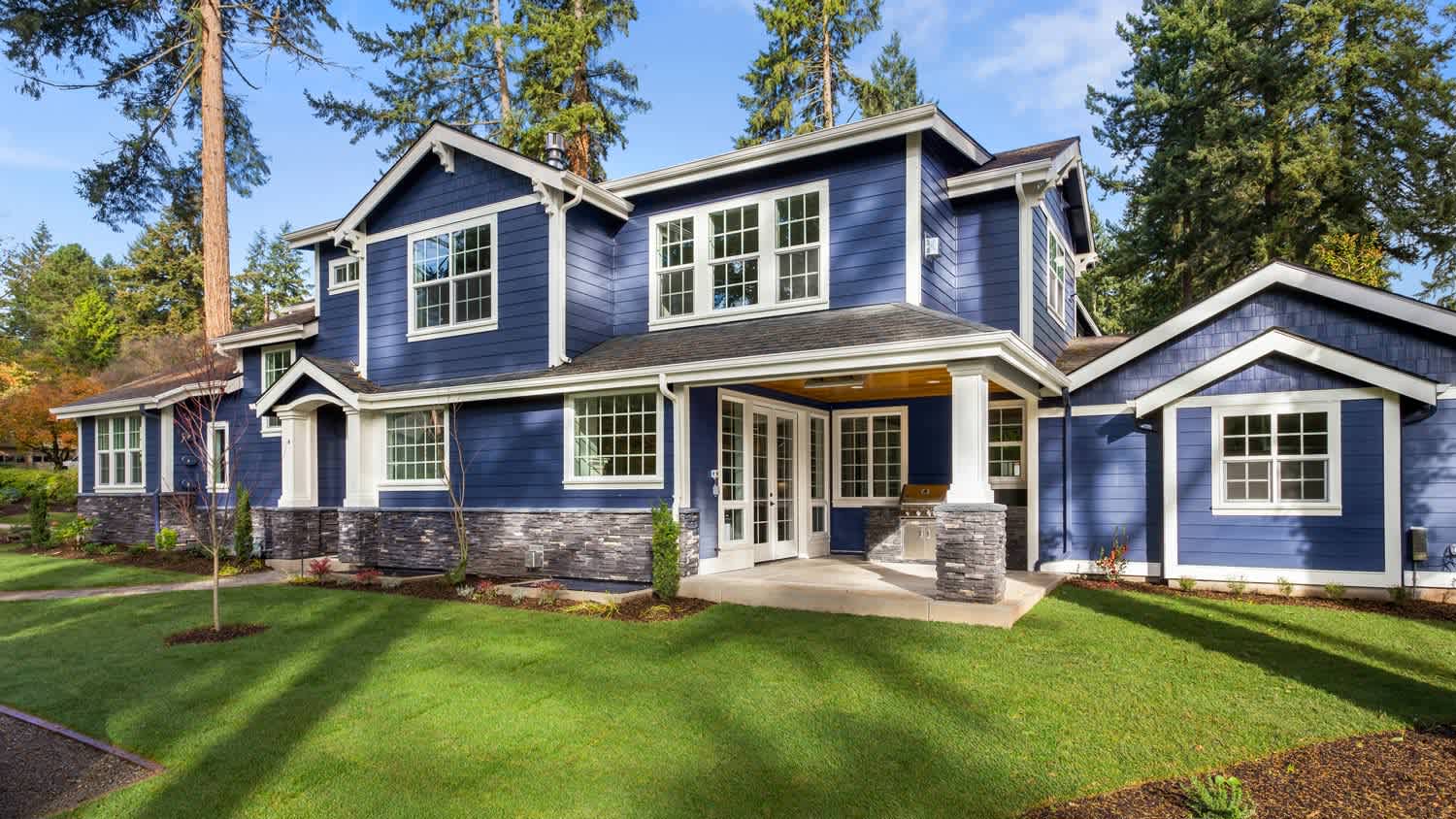 The exterior of a luxury house on a sunny day