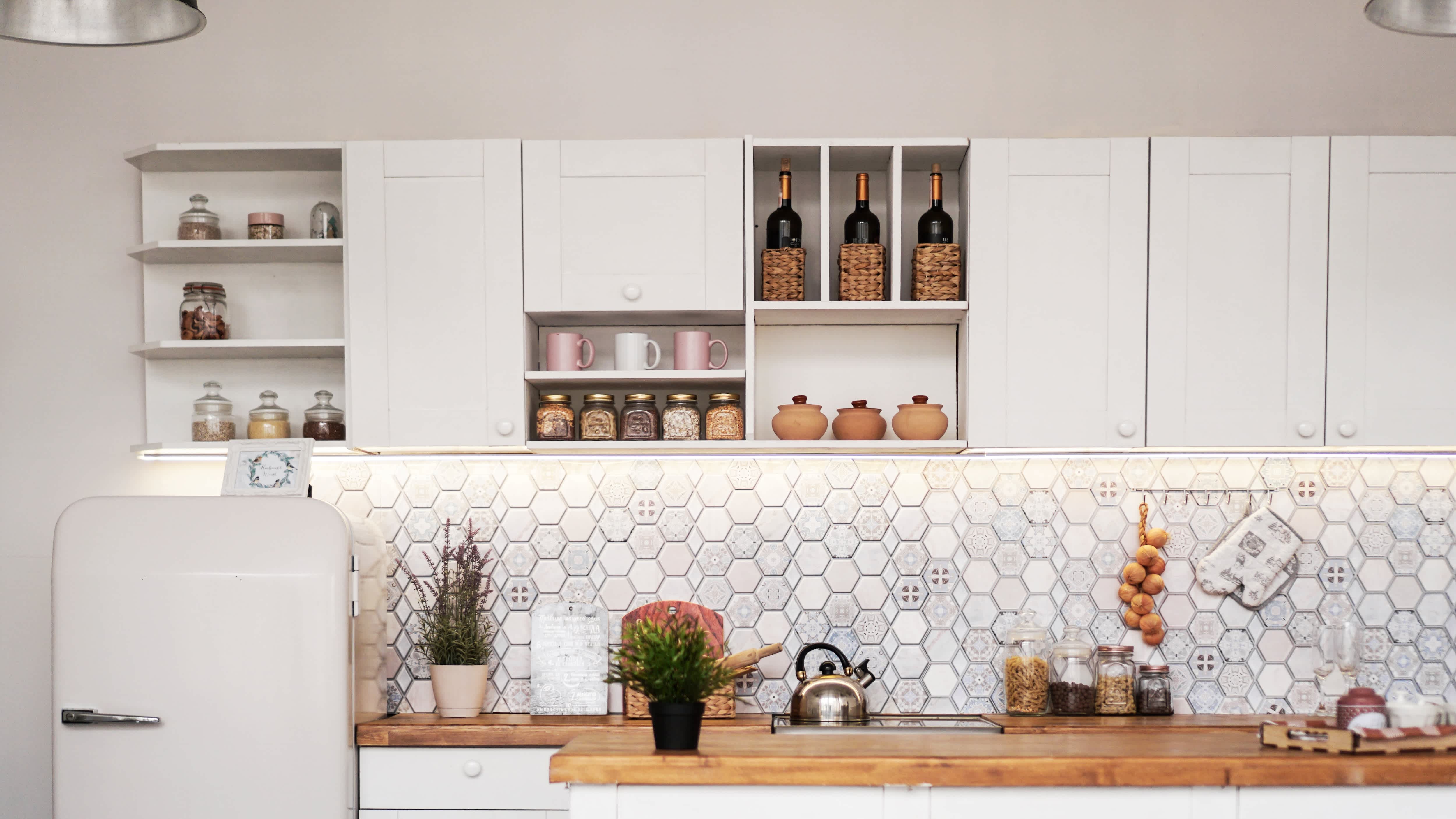 Large kitchen with open shelving and cabinetry