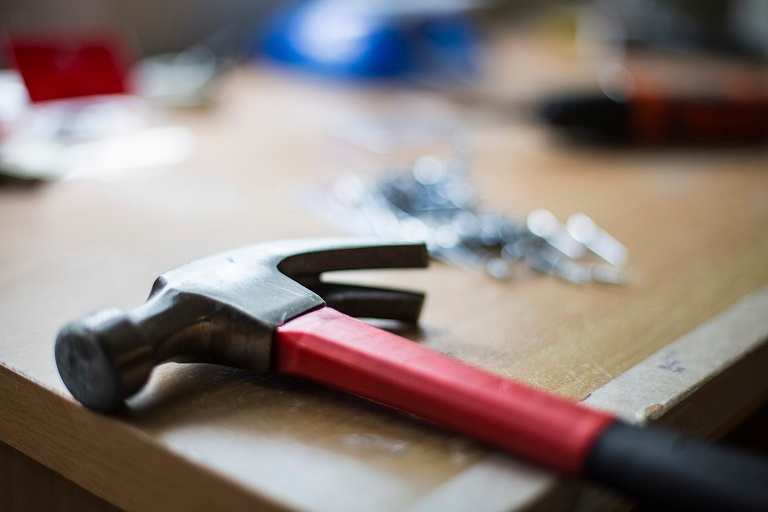 Hammer on table