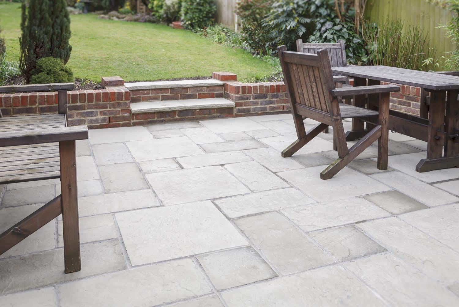 New stone garden patio in backyard