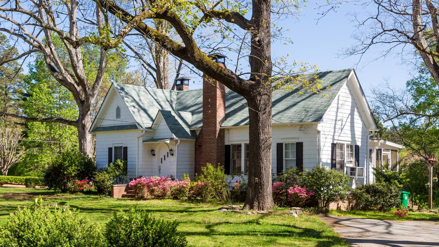 A beautiful suburban house with a lush garden
