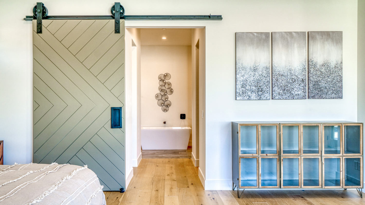 Bathroom with sliding barn door with contemporary design