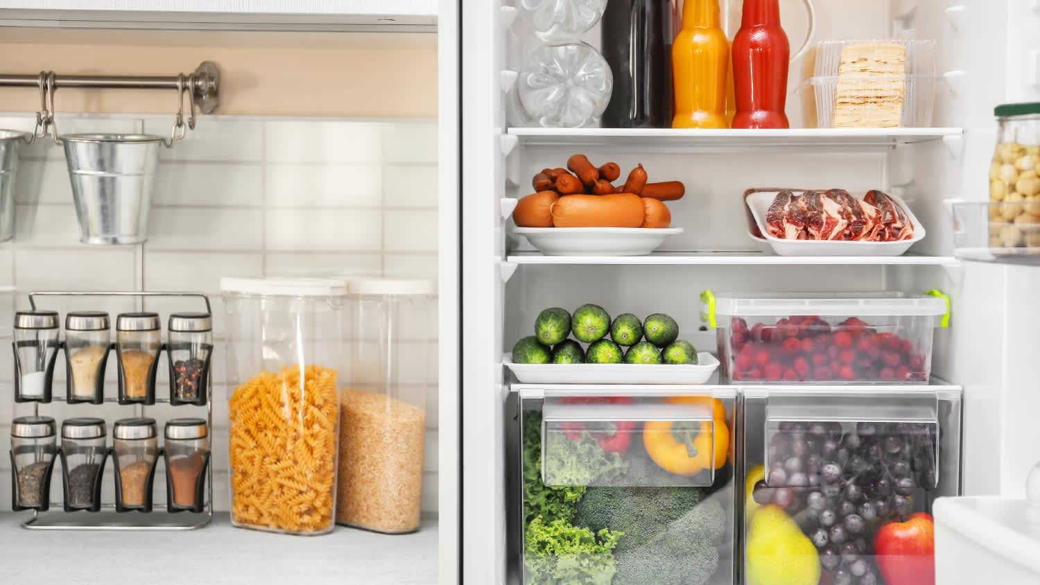 Refrigerator with different products in kitchen