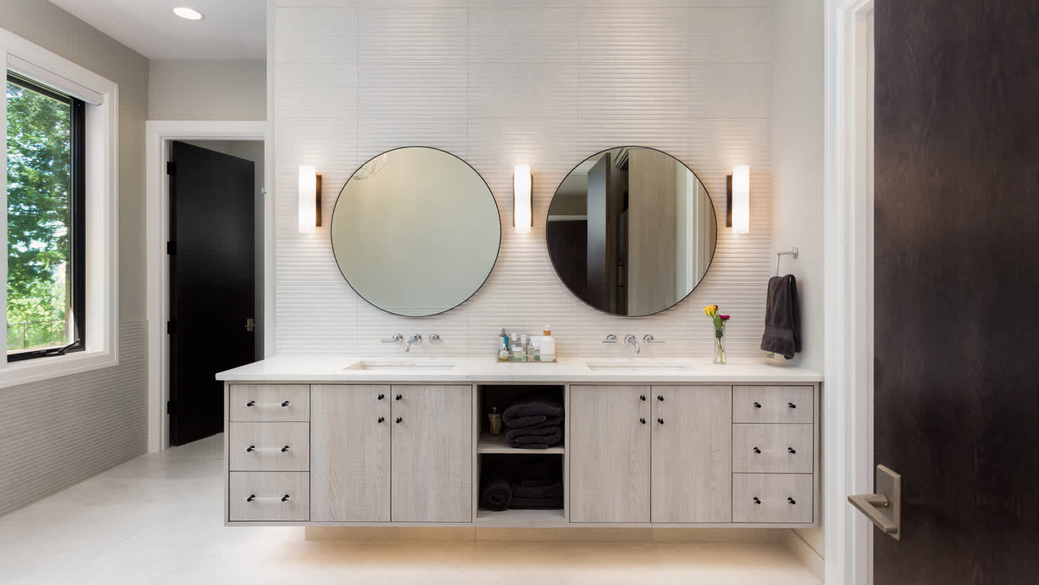 Contemporary floating vanity with dual sinks in large bathroom